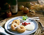 Apple fritters with zabaglione on plate