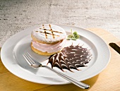 Strawberry cream biscuit with chocolate sauce on plate