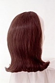 Artificial brunette hair with outer roller