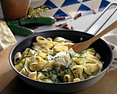 Chilli pasta with zucchini in pan