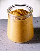 Close-up of barbecue and mustard sauce in glass jar