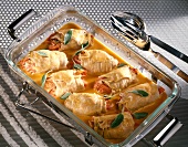 Close-up of pork roulades with pepper filling in baking dish