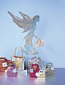 Advent calendar in shape of angel and small shopping bags
