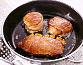 Beef rump steak and tournedos cooked in pan