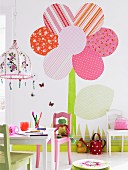 Colourful child's bedroom with hand-crafted flower decorating wall