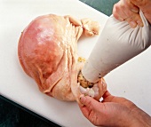 Pig stomach filled using piping bag