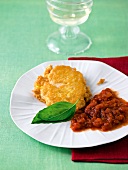 Mini-Parmesan steak with tomato sauce on plate