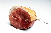 Close-up of rolled ham on white background
