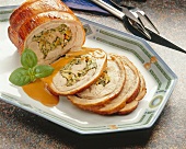 Veal breast stuffed with carrots, leeks, mushrooms and parsley in serving dish