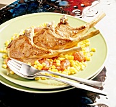 Lamb chops with sweetcorn on plate