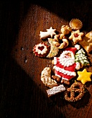 Various assorted Christmas cookies on wooden surface