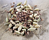 Close-up of cardamom and its seeds on stone