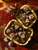 Homemade chocolates in golden bowls