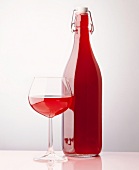 Black currant juice in bottle and glass