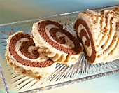 Close-up of two slices of Swiss roll with praline cream
