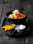 Shrimp and mango curry in bowl