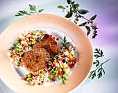 Beef fillets with vegetable and rice on plate