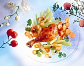 Chicken leg with vegetables on plate