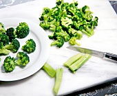 Sliced broccoli on chopping board