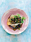 Shrimp cod with teriyaki mushrooms and bean puree on plate