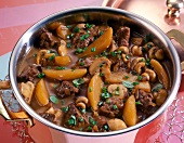 Goulash with potatoes and mushrooms in pot