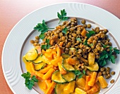 Close-up of lentil curry with pineapple, carrots and zucchini on plate