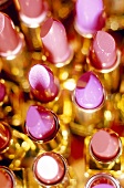 Close-up of several shades of pink lipstick