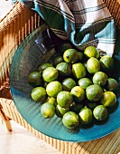 Green limes in large bowl