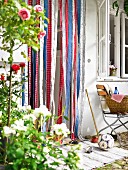 Fly curtain of colourful fabric strips in garden door
