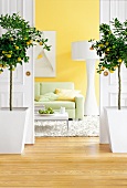 Living room with yellow wallpaper and lemon trees