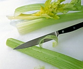 Threads being removed from celery with knife