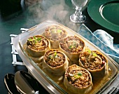 Baked cannelloni with mince filling on serving plate