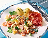 Vegetable ragout with petersilienkartoffel and ham on plate