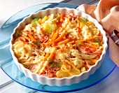 Carrots and fennel in casserole on blue plate