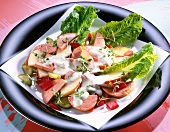 Salad with sausage and peppers in dish
