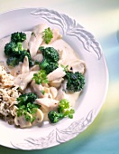 Chicken fricassee with mushrooms and broccoli in dish