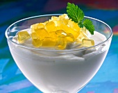 Glass of lemon cream with lemon jelly, close-up