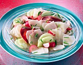 Radish salad with radishes and cucumber in bowl