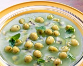 Gooseberry and kiwi fruit gazpacho with mint leaves