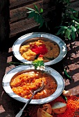 Curry beans and yellow curry with red lentils and mung served in serving dish