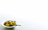 Eggplant curry in bowl on white background