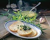 Salsa al dragoncello with baguette slices on plate