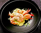 Close-up of lobster with tarragon and chervil sauce in pan