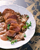 Close-up of duck breast with oyster mushroom in dish