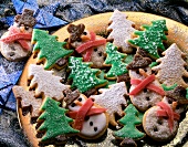 Close-up of Christmas cookies shaped in snowmen and fir trees