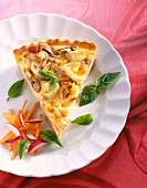 Close-up of mushroom and vegetable pie with cheese and pine nuts in dish