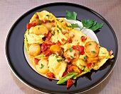 Close-up of omelette with potatoes, peppers and leeks