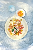 Turbot fillet with fennel and rhubarb vinaigrette on plate