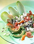 Close-up of rice salad with shrimp, avocado and chicory in bowl