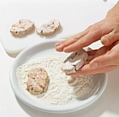Flour being applied on sliced deer brain, step 5